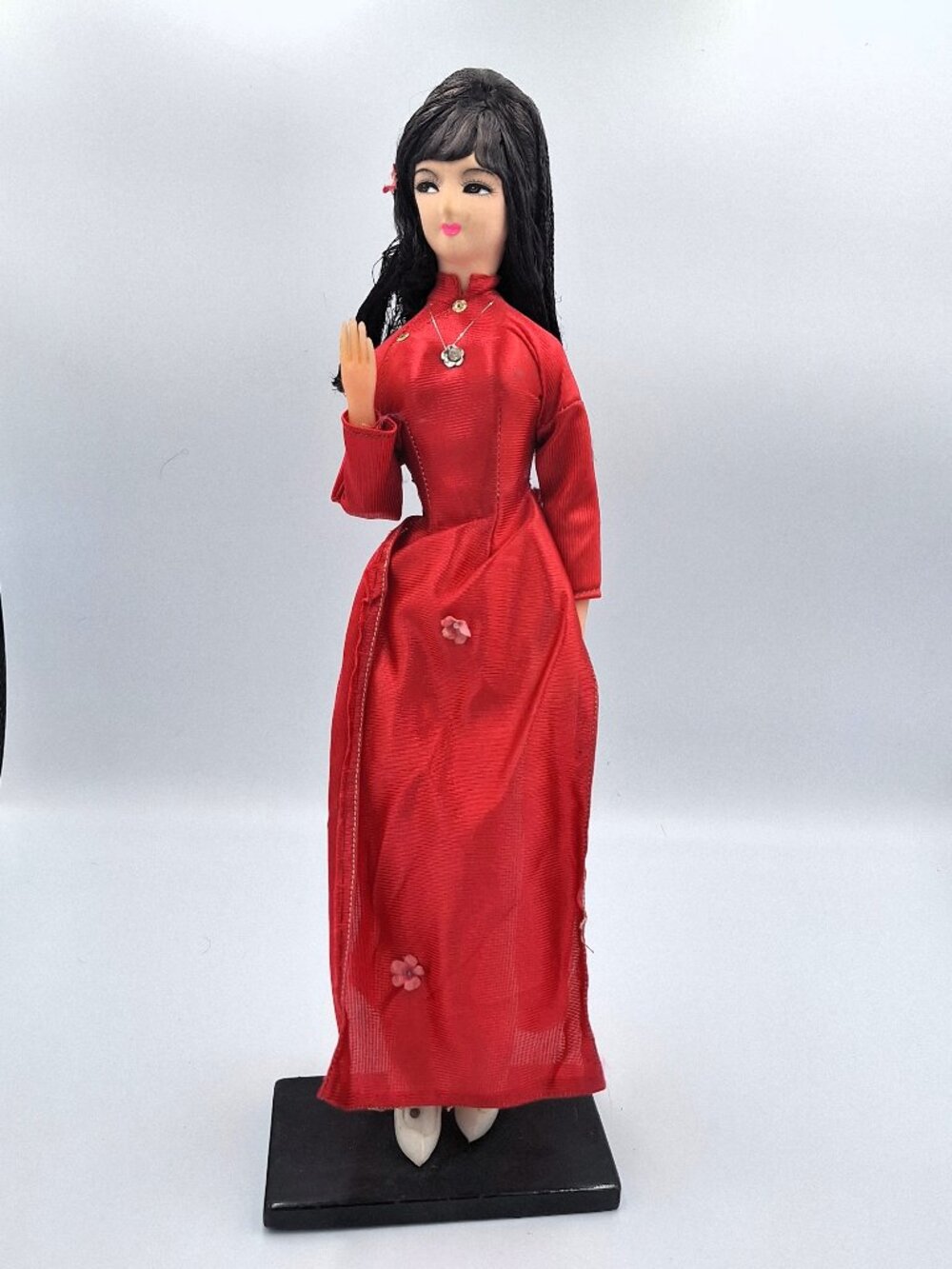 Vintage traditional souvenir doll wearing a Vietnamese Ao Dai